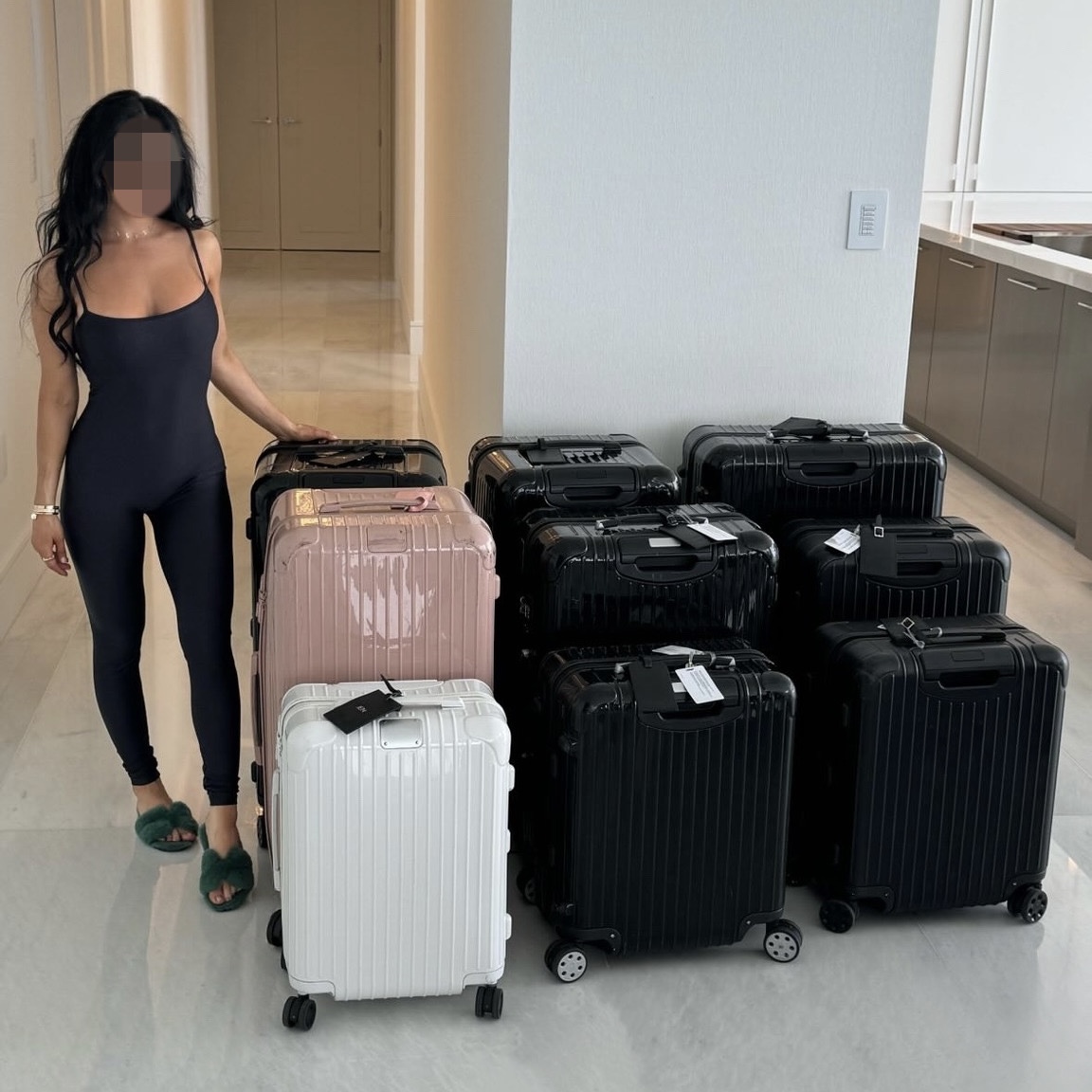 A woman standing with multiple suitcases